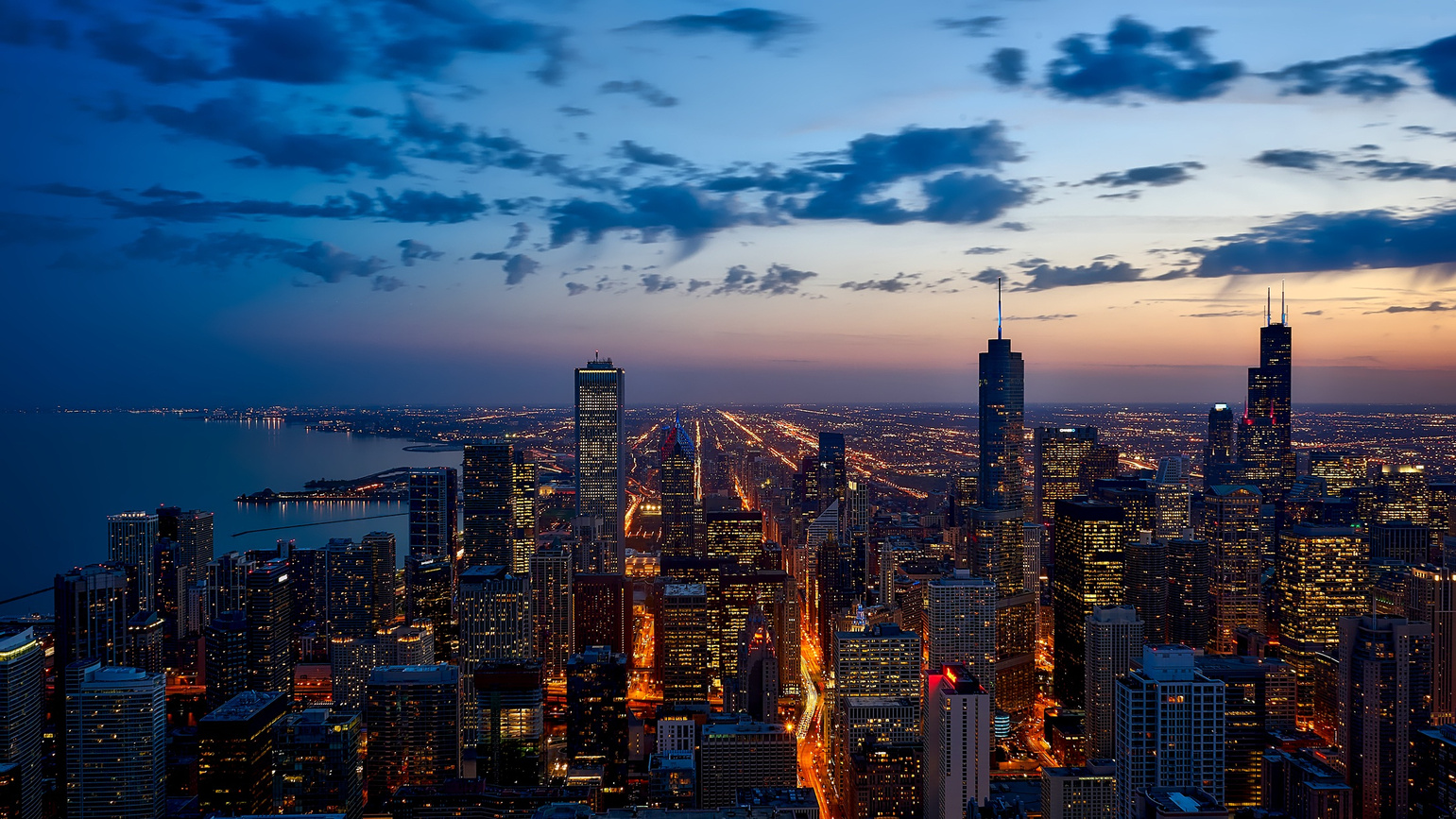 City skyline at dusk representing urban growth and infrastructure